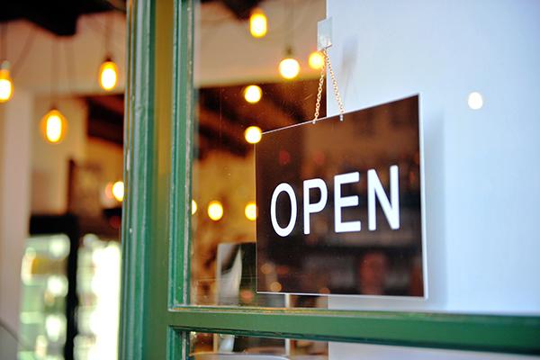 hanging open sign on shop door